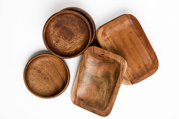 wooden round and rectangular eco-friendly bowls on white background