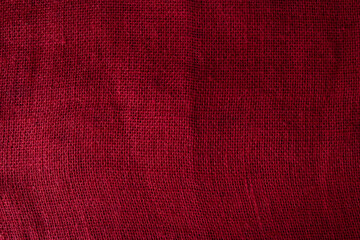 Background with red jute fiber texture.