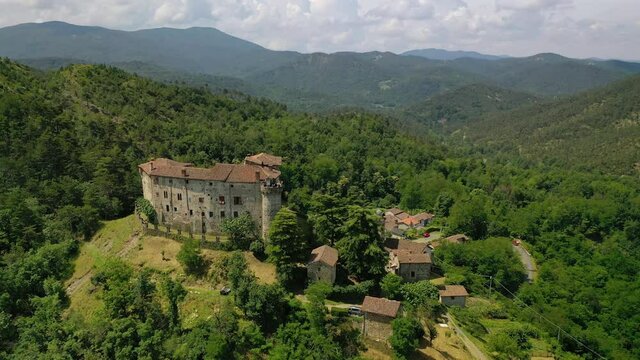 Aerial view around the Casaleggio Boiro castle, Piedmont, Italy - circling, drone shot