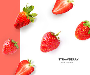 Creative layout made of strawberry on the pink and white background. Flat lay. Food concept.