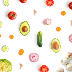 Creative layout made of cucumber, tomato, garlic, onion, avocado and cabbage on the white background. Flat lay. Food concept.