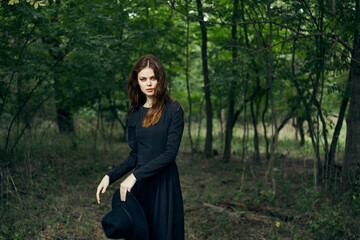 cheerful woman witch in the forest posing fantasy