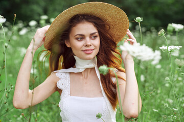 pretty woman in white dress and hat posing flowers nature