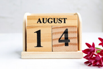Hello August, Cube wooden calendar showing date on 14 August. Wooden calendar with date on the...