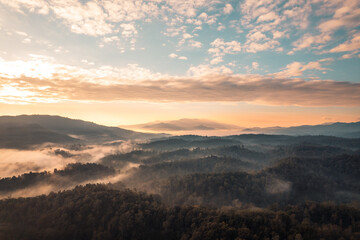 Flying above the clouds sunrise and fog