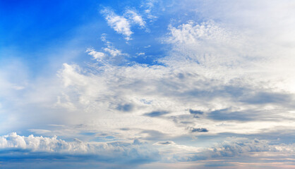 White clouds on blue sky background panoramic view, beautiful cloudscape panorama, cloudy skies backdrop, fluffy cloud texture, sunny heaven, cloudiness weather, evening sunset, morning sunrise, dawn