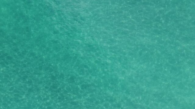 Drone footage of Atlantic Ocean sparkly clear at Juno Beach, Florida.
