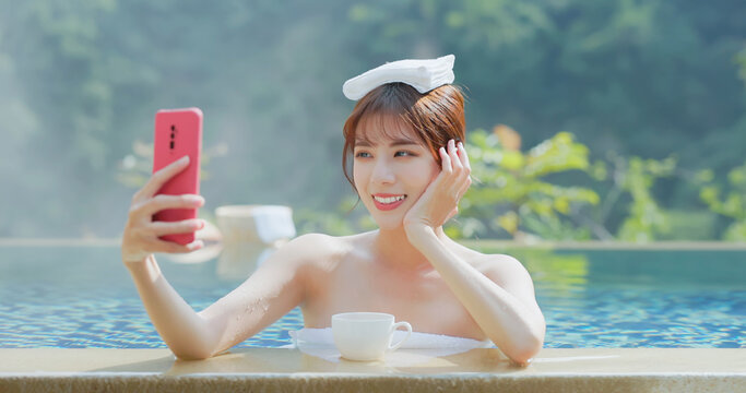 woman take selfie in hot spring
