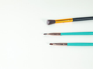 makeup tools brush on white background on top view