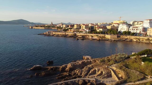 Drone shot flying over the Mediterranean Sea on the coast of Alghero, Italy