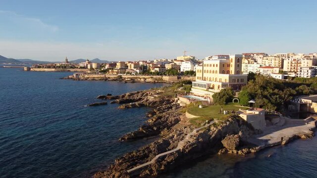 Incredible aerial shot over the city of Alghero in Italy. Cinematic landscape view