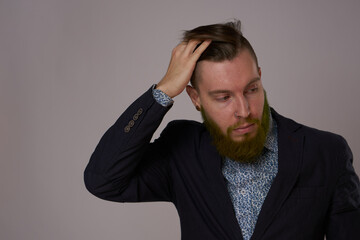 handsome bearded man in jacket fashion posing close-up