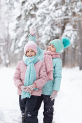 children playing in snow in forest
