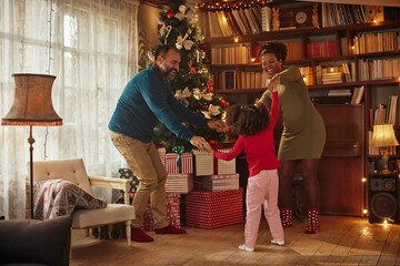 Fototapeta na wymiar Mixed race family celebrating Christmas at home