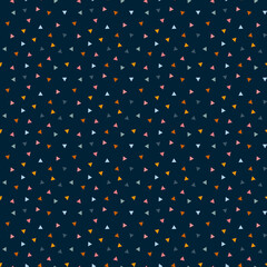 Colored triangles on a dark blue background. Seamless pattern, vector.