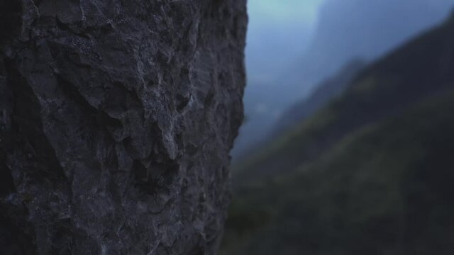 green mountains from behind the rock
