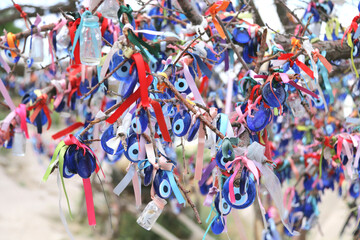 Evil eye charms hang from a tree, Cappadocia, Turkey