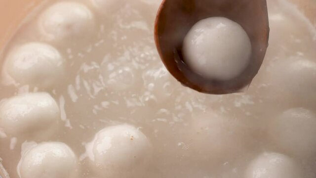 Boiling traditional big delicious tangyuan for Winter Solstice Festival food