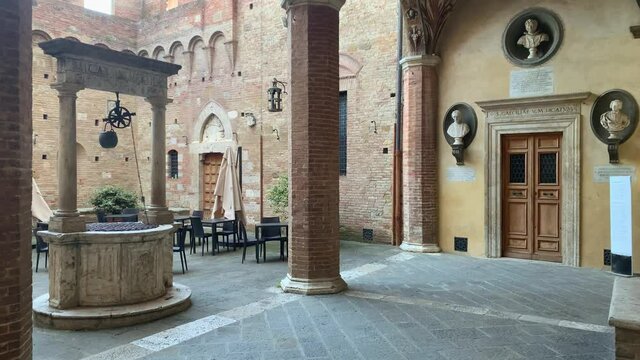 Static shot of medieval courtyard in Palazzo Chigi, in Siena, Tuscany, Italy