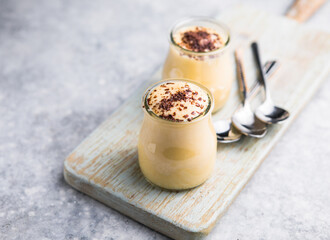 Custard cream in glasses with chocolate