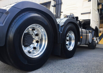 Rear of a Big Semi Truck Wheels Tires. Rubber. New Tyres with Chrome Wheels.