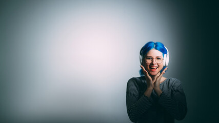 Music satisfaction. Audio playlist. Sound quality. Joyful excited woman in headphones isolated on white vignette copy space background.