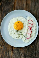 Breakfast in the morning with fried egg and tzatziki