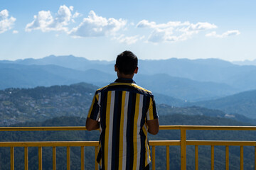 view of almora city from kesar devi on a bright sunny day