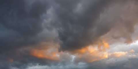 Dramatic cumulus clouds on the sky, sunrise in the mountains in winter, atmosphere background