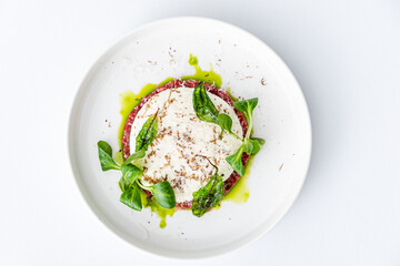 beef tartare with sauce and herbs