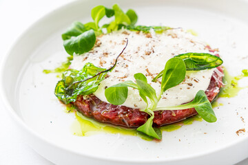 beef tartare with sauce and herbs