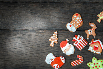 Christmas gingerbread cookies on wooden  surface