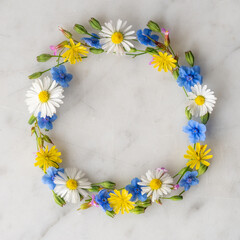 Beautiful Wreath of Wild Flowers on Marble Background with Copy Space - Flat Lay