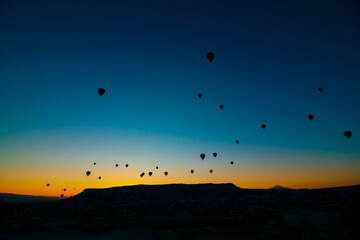 Hot air balloons. Silhouette of hot air balloons at sunrise in Cappadocia