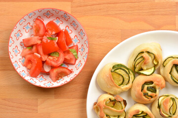 Zucchini rolls and tomato salad