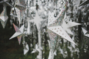 Garland of silver stars with bokeh