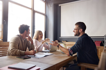 Business people talking and working at office