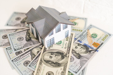 house layout and dollar bills on the background