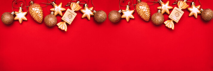 Gold Christmas balls and toys on a red background