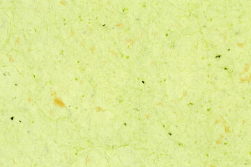 Surface of thin flat unleavened breads with spinach, top view