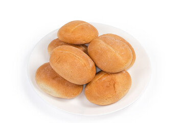 Pile of small buns on white dish on white background