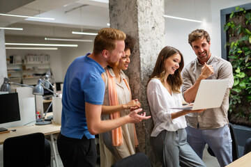 Group of happy business people discussing and working together during a meeting in office