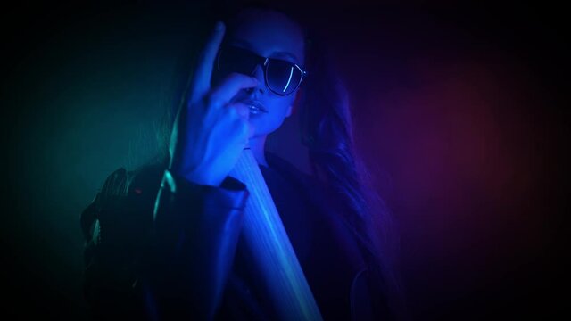 Gangster abstract lady on neon light filter threat bat vandalism fighting