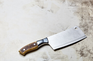 Meat cleaver on wooden background. Stainless steel Kitchen knife or Butcher cleaver on a wood...