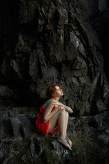 Beautiful red-haired woman in the forest, unity with nature, romantic mysterious portrait of a girl, twilight nature