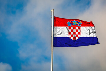 A Flag of Croatia flying on a Flagpole against the Sky