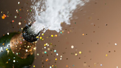 Freeze motion of champagne explosion with flying cork closure, opening champagne bottle closeup,...