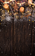 Naklejka premium Christmas decoration on wooden background, lots of copy space for product or text.