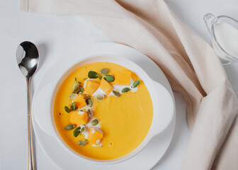 Pumpkin soup. Pumpkin seeds. View from above