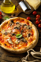 Traditional homemade pizza with mushroom and ham